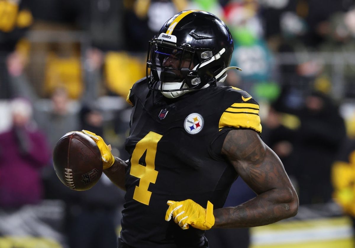 Dec 15, 2025; Pittsburgh, Pennsylvania, USA; Pittsburgh Steelers wide receiver DK Metcalf (4) scores a touchdown in the third quarter against the Miami Dolphins at Acrisure Stadium. Mandatory Credit: Charles LeClaire-Imagn Images