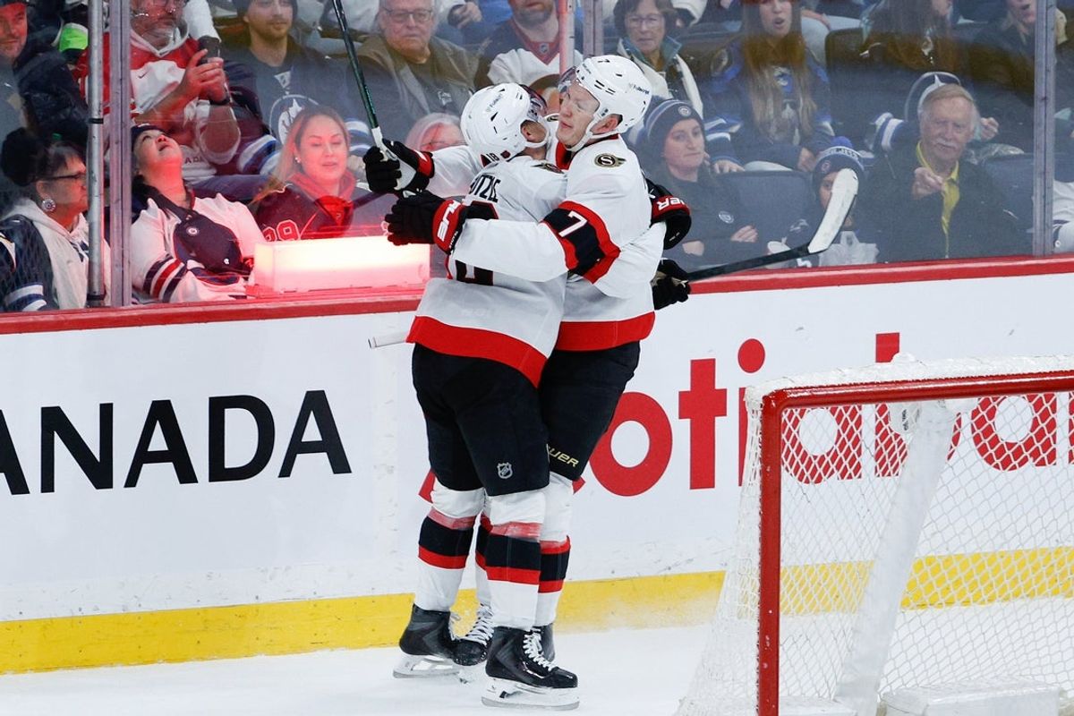 , toppicDec 15, 2025; Winnipeg, Manitoba, CAN;  Ottawa Senators forward Tim Stutzle (18) is congratulated by Ottawa Senators forward Brady Tkachuk (7) on his goal against the Winnipeg Jets during the overtime period at Canada Life Centre. Mandatory Credit: Terrence Lee-Imagn Images