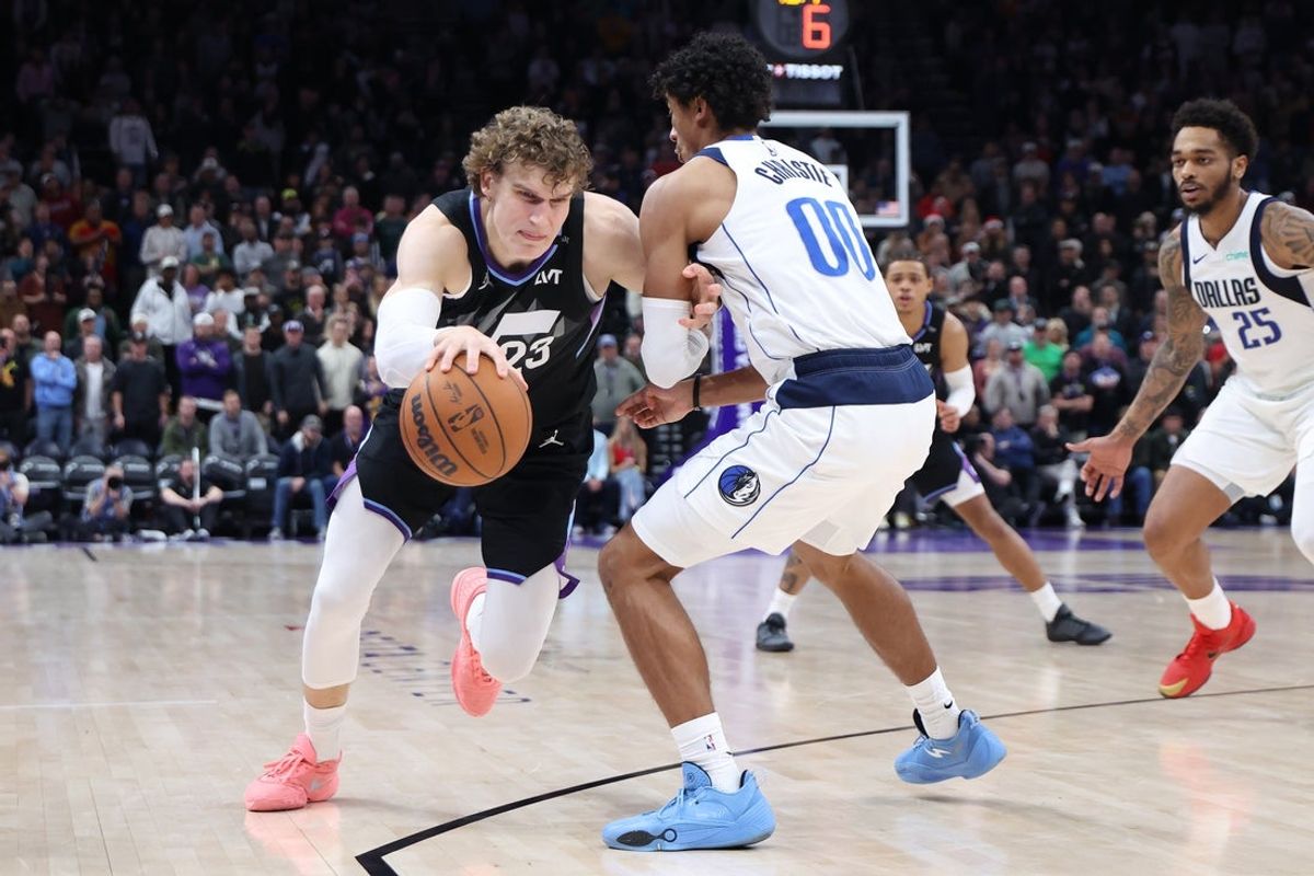 Dec 15, 2025; Salt Lake City, Utah, USA; Utah Jazz forward Lauri Markkanen (23) moves the ball against Dallas Mavericks guard Max Christie (00) during the second half at Delta Center. Mandatory Credit: Rob Gray-Imagn Images