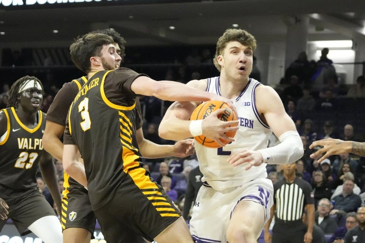 Dec 16, 2025; Evanston, Illinois, USA; Valparaiso Beacons guard Brody Whitaker (3) defends Northwestern Wildcats forward Nick Martinelli (2) during the first half at Welsh-Ryan Arena. Mandatory Credit: David Banks-Imagn Images