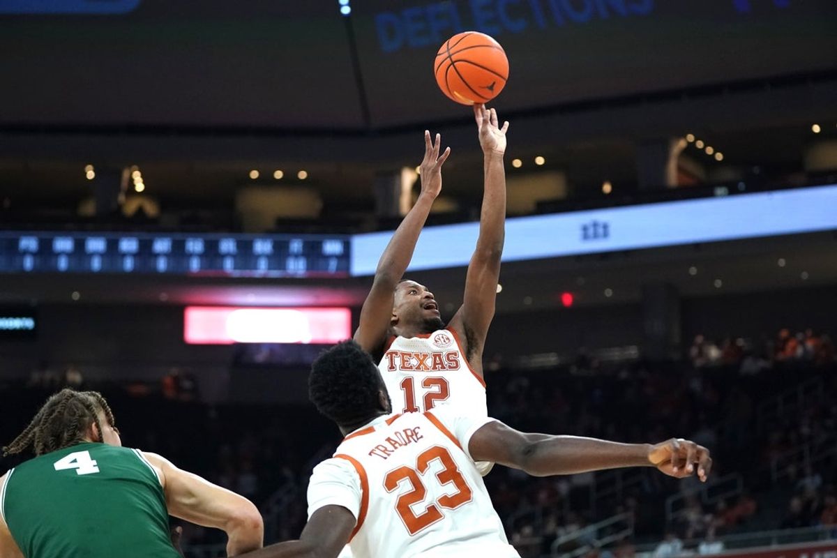 Dec 16, 2025; Austin, Texas, USA; Texas Longhorns guard Tramon Mark (12) shoots the ball against the Le Moyne Dolphins during the first half at Moody Center. Mandatory Credit: Dustin Safranek-Imagn Images