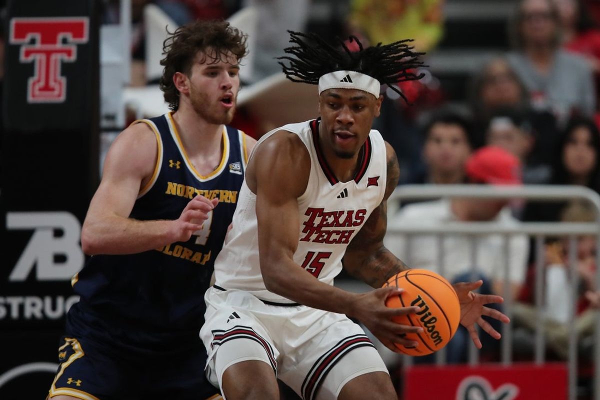 Dec 16, 2025; Lubbock, Texas, USA;  Northern Colorado Bears forward Brock Wisne (14) blocks Texas Tech Red Raiders forward JT Toppin (15) in the first half at United Supermarkets Arena. Mandatory Credit: Michael C. Johnson-Imagn Images