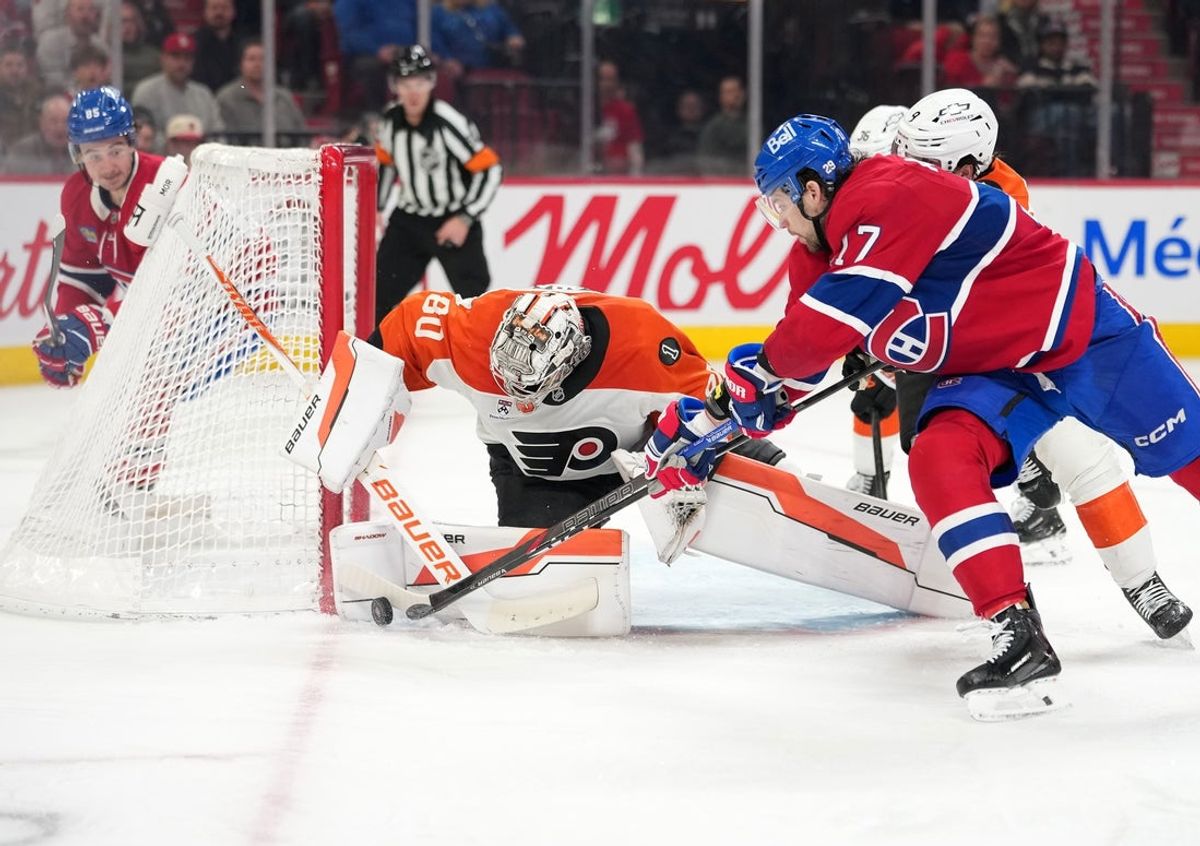 Dec 16, 2025; Montreal, Quebec, CAN; Philadelphia Flyers goalie Dan Vladar (80) stops Montreal Canadiens forward Josh Anderson (17) during the third period at the Bell Centre. Mandatory Credit: Eric Bolte-Imagn Images