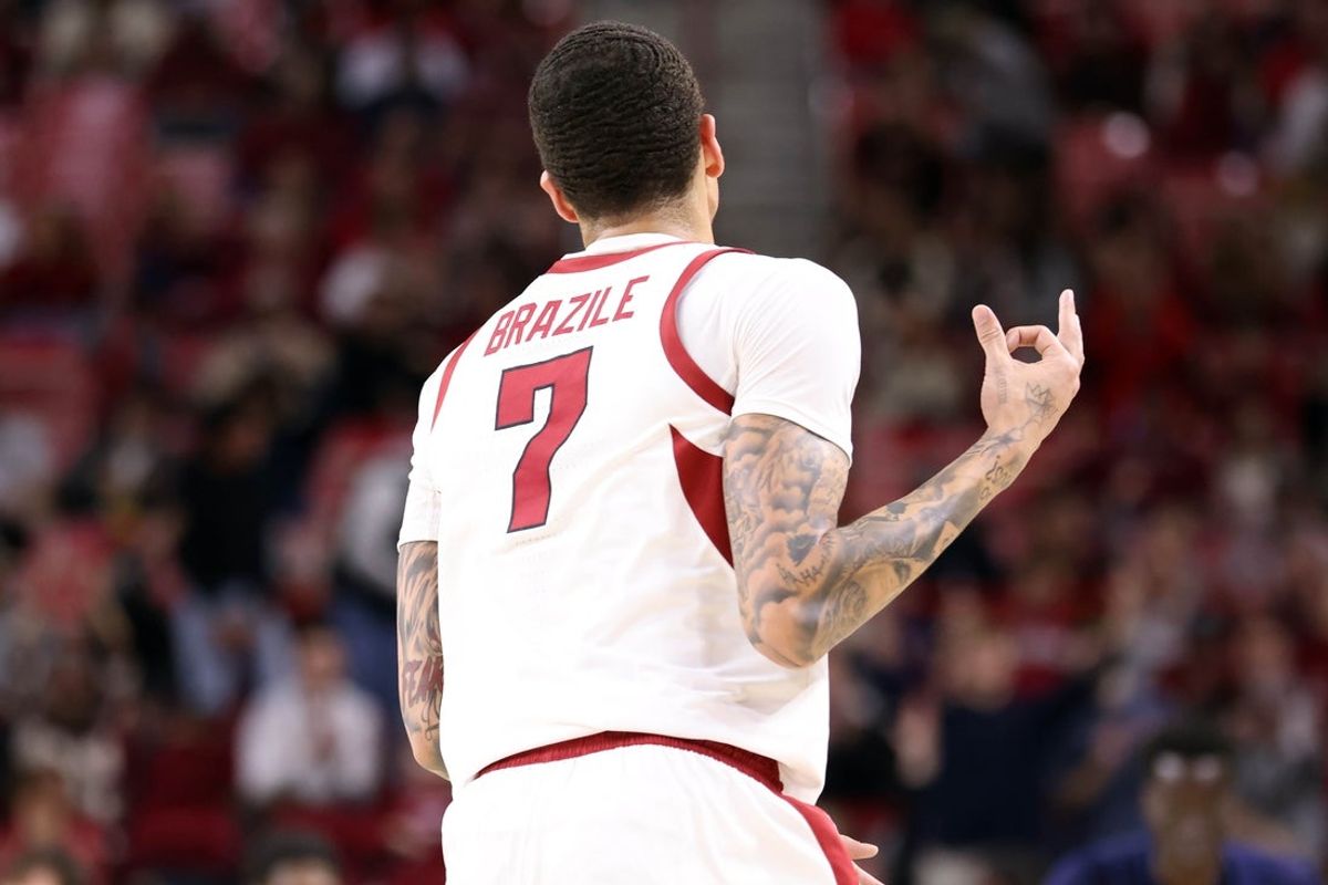 Dec 16, 2025; Fayetteville, Arkansas, USA; Arkansas Razorbacks forward Trevon Brazile (7) celebrates after making a three point shot against the Queens Royals during the first half at Bud Walton Arena. Mandatory Credit: Nelson Chenault-Imagn Images