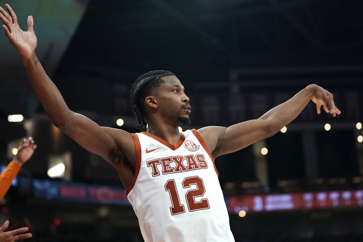 Dec 16, 2025; Austin, Texas, USA; Texas Longhorns guard Tramon Mark (12) makes a three point basket during the second half against the Le Moyne Dolphins at Moody Center. Mandatory Credit: Dustin Safranek-Imagn Images