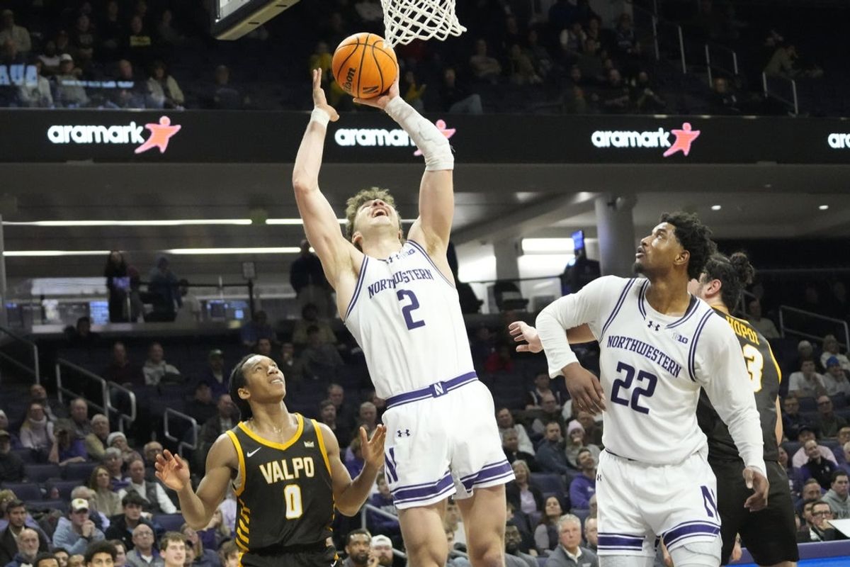 Dec 16, 2025; Evanston, Illinois, USA; Valparaiso Beacons guard Rakim Chaney (0) defends Northwestern Wildcats forward Nick Martinelli (2) during the second half at Welsh-Ryan Arena. Mandatory Credit: David Banks-Imagn Images