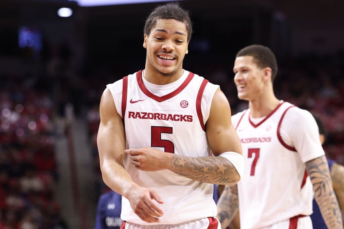 Dec 16, 2025; Fayetteville, Arkansas, USA; Arkansas Razorbacks guard Darius Acuff Jr (5) celebrates after a play against the Queens Royals during the second half at Bud Walton Arena. Arkansas won 108-80. Mandatory Credit: Nelson Chenault-Imagn Images