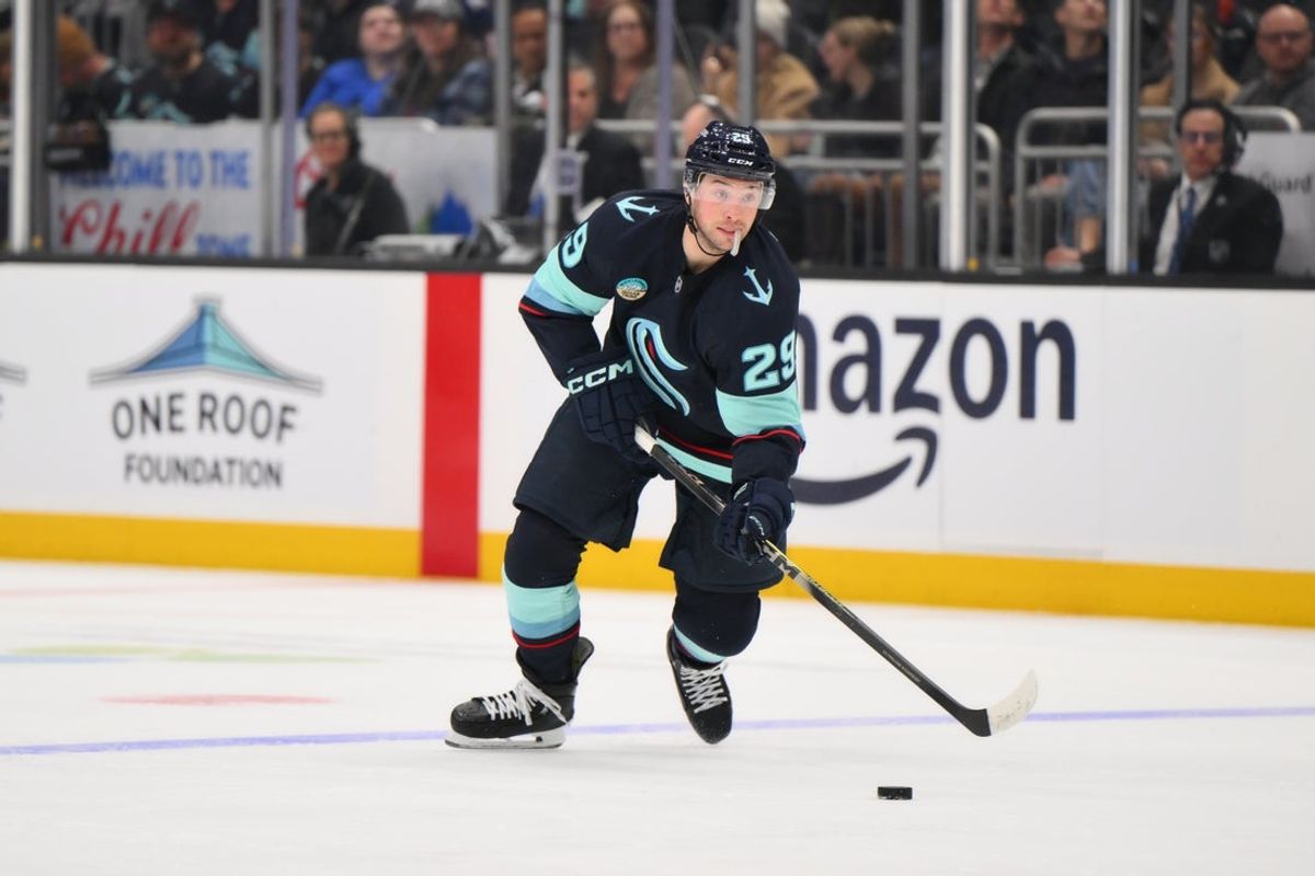 Dec 16, 2025; Seattle, Washington, USA; Seattle Kraken defenseman Vince Dunn (29) plays the puck during the second period against the Colorado Avalanche at Climate Pledge Arena. Mandatory Credit: Steven Bisig-Imagn Images