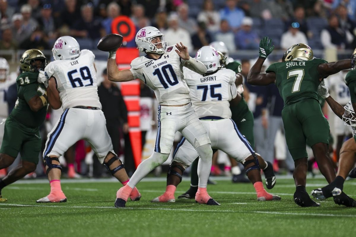 Dec 17, 2025; Orlando, FL, USA; Old Dominion Monarchs quarterback Quinn Henicle (10) attempts a pass against the South Florida Bulls in the second quarter during the Cure Bowl at Camping World Stadium. Mandatory Credit: Nathan Ray Seebeck-Imagn Images