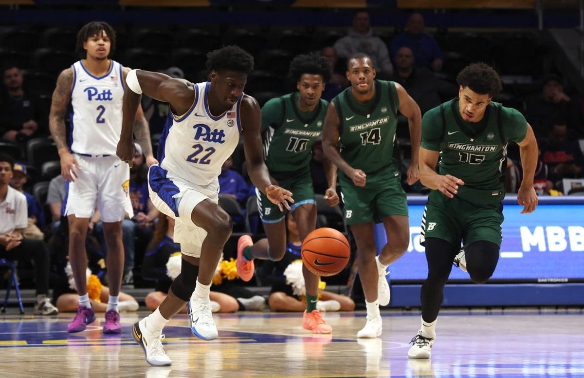 Dec 17, 2025; Pittsburgh, Pennsylvania, USA;  Pittsburgh Panthers guard Barry Dunning Jr. (22) brings the ball up court on a fast break against the Binghamton Bearcats during the first half at the Petersen Events Center. Mandatory Credit: Charles LeClaire-Imagn Images