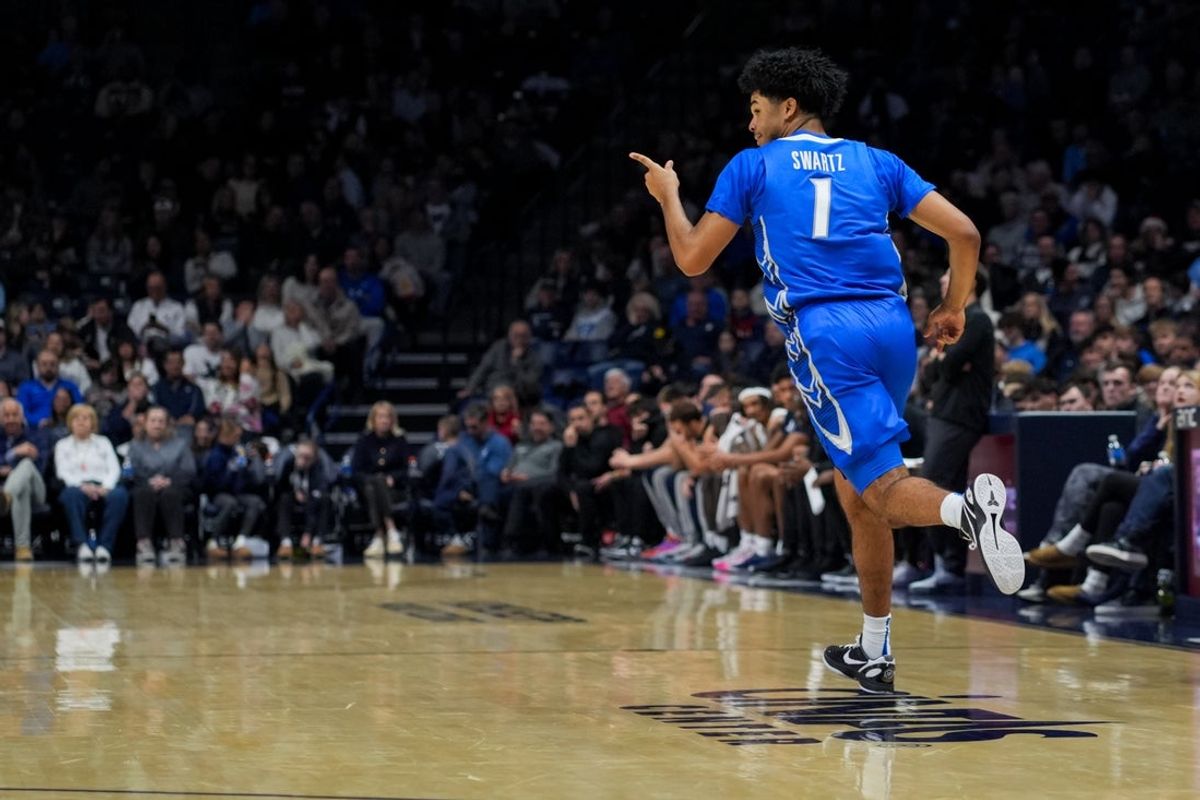 Dec 17, 2025; Cincinnati, Ohio, USA;  Creighton Bluejays guard Austin Swartz (1) reacts to making a 3-point shot against the Xavier Musketeers in the second half at the Cintas Center. Mandatory Credit: Aaron Doster-Imagn Images