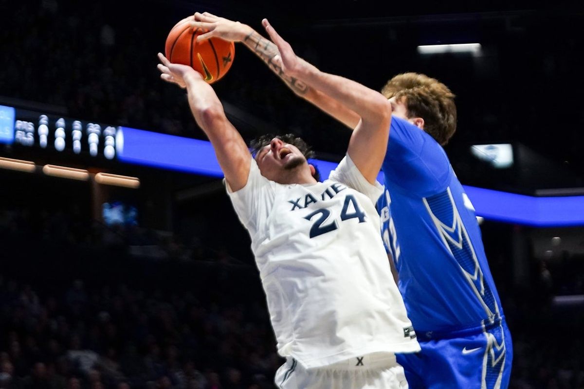 Creighton Bluejays forward Owen Freeman (32) blocks a layup by Xavier Musketeers forward Jovan Milicevic (24) in the first half of a NCAA men’s basketball game between the Xavier Musketeers and Creighton Bluejays, Wednesday, Dec. 17, 2025, at Cintas Center in Cincinnati.