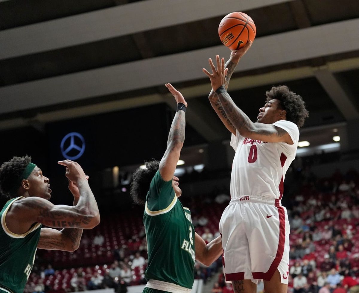 Dec 17, 2025; Tuscaloosa, AL, USA; Alabama guard Labaron Philon Jr. (0) shoots over South Florida guard Joseph Pinion (5) at Coleman Coliseum. Mandatory Credit: Gary Cosby Jr.-Tuscaloosa News
