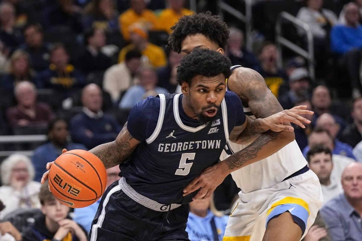 Dec 17, 2025; Milwaukee, Wisconsin, USA;  Georgetown Hoyas guard KJ Lewis (5) drives for the basket during the first half against the Marquette Golden Eagles at Fiserv Forum. Mandatory Credit: Jeff Hanisch-Imagn Images
