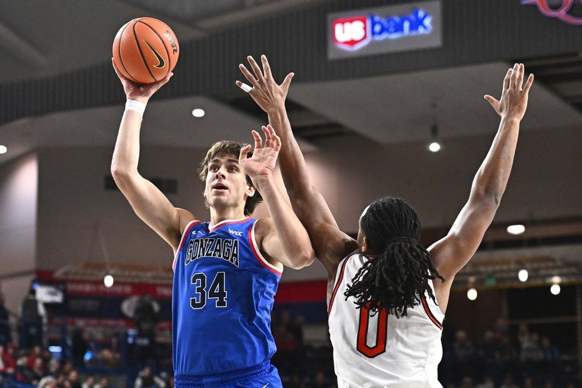 Dec 17, 2025; Spokane, Washington, USA; Gonzaga Bulldogs forward Braden Huff (34) shoots the ball against Campbell Fighting Camels forward Chris Fields Jr. (0) in the first half at McCarthey Athletic Center. Mandatory Credit: James Snook-Imagn Images