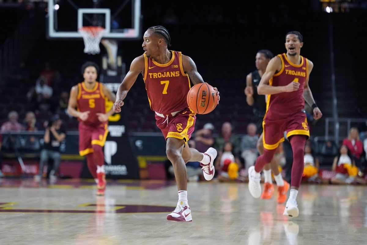 Dec 17, 2025; Los Angeles, California, USA; Southern California Trojans guard Jordan Marsh (7) dribbles the ball against the UTSA Roadrunners in the first half at Galen Center. Mandatory Credit: Kirby Lee-Imagn Images