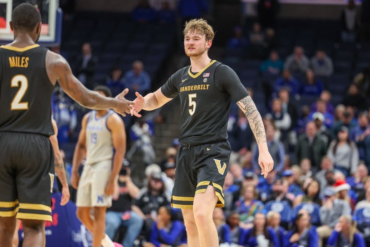 Dec 17, 2025; Memphis, Tennessee, USA; Vanderbilt Commodores guard Tyler Nickel (5) and guard Duke Miles (2) high five against the Memphis Tigers during the second half at FedExForum. Mandatory Credit: Wesley Hale-Imagn Images