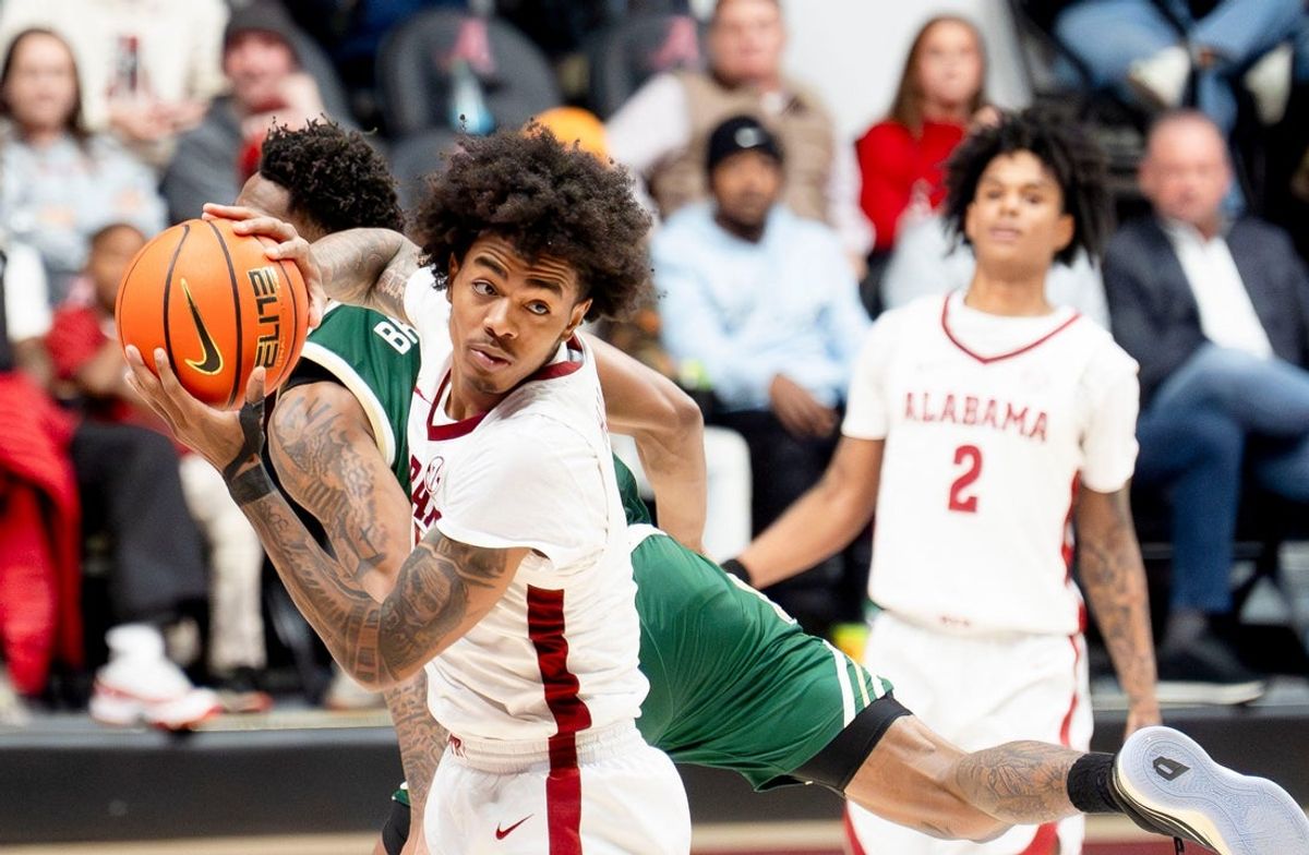 Dec 17, 2025; Tuscaloosa, AL, USA; Alabama guard Labaron Philon Jr. (0) pulls a pass away from South Florida guard CJ Brown (11) during a full court press by USF at Coleman Coliseum. Mandatory Credit: Gary Cosby Jr.-Tuscaloosa News