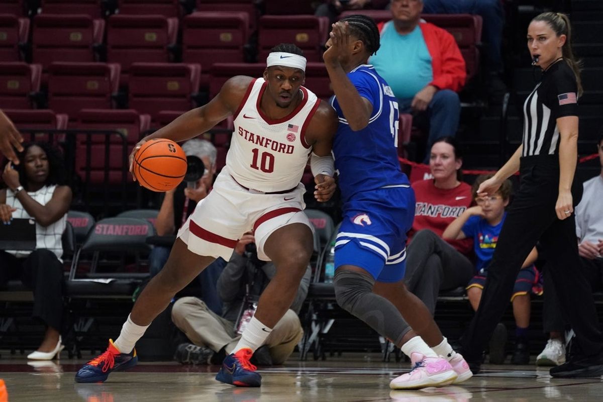 Dec 17, 2025; Stanford, California, USA;  Stanford Cardinal forward Chisom Okpara (10) drives to the basket against Texas-Arlington Mavericks guard Marcell McCreary (42) in the first half at Maples Pavilion. Mandatory Credit: David Gonzales-Imagn Images