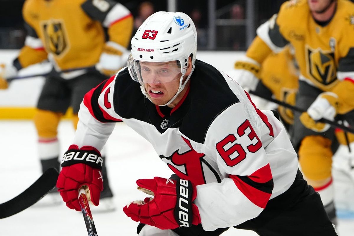 Dec 17, 2025; Las Vegas, Nevada, USA; New Jersey Devils left wing Jesper Bratt (63) skates against the Vegas Golden Knights during the first period at T-Mobile Arena. Mandatory Credit: Stephen R. Sylvanie-Imagn Images