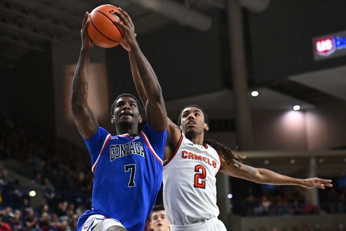 Dec 17, 2025; Spokane, Washington, USA; Gonzaga Bulldogs guard Tyon Grant-Foster (7) shoots the ball against Campbell Fighting Camels guard Jeremiah Johnson (2) in the second half at McCarthey Athletic Center. Gonzaga Bulldogs won 98-70. Mandatory Credit: James Snook-Imagn Images