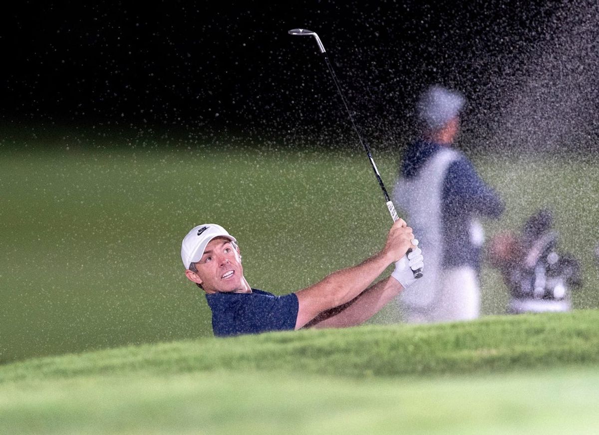 Rory McIlroy hits the ball out of a bunker during the Golf Channel Games at Trump National Golf Club on December 17, 2025, in Jupiter, Florida.