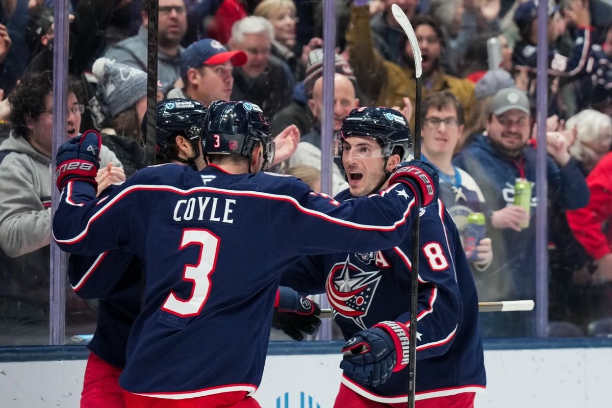 Dec 18, 2025; Columbus, Ohio, USA;  Columbus Blue Jackets defenseman Zach Werenski (8) celebrates with teammates after scoring a goal against the Minnesota Wild in the first period at Nationwide Arena. Mandatory Credit: Aaron Doster-Imagn Images