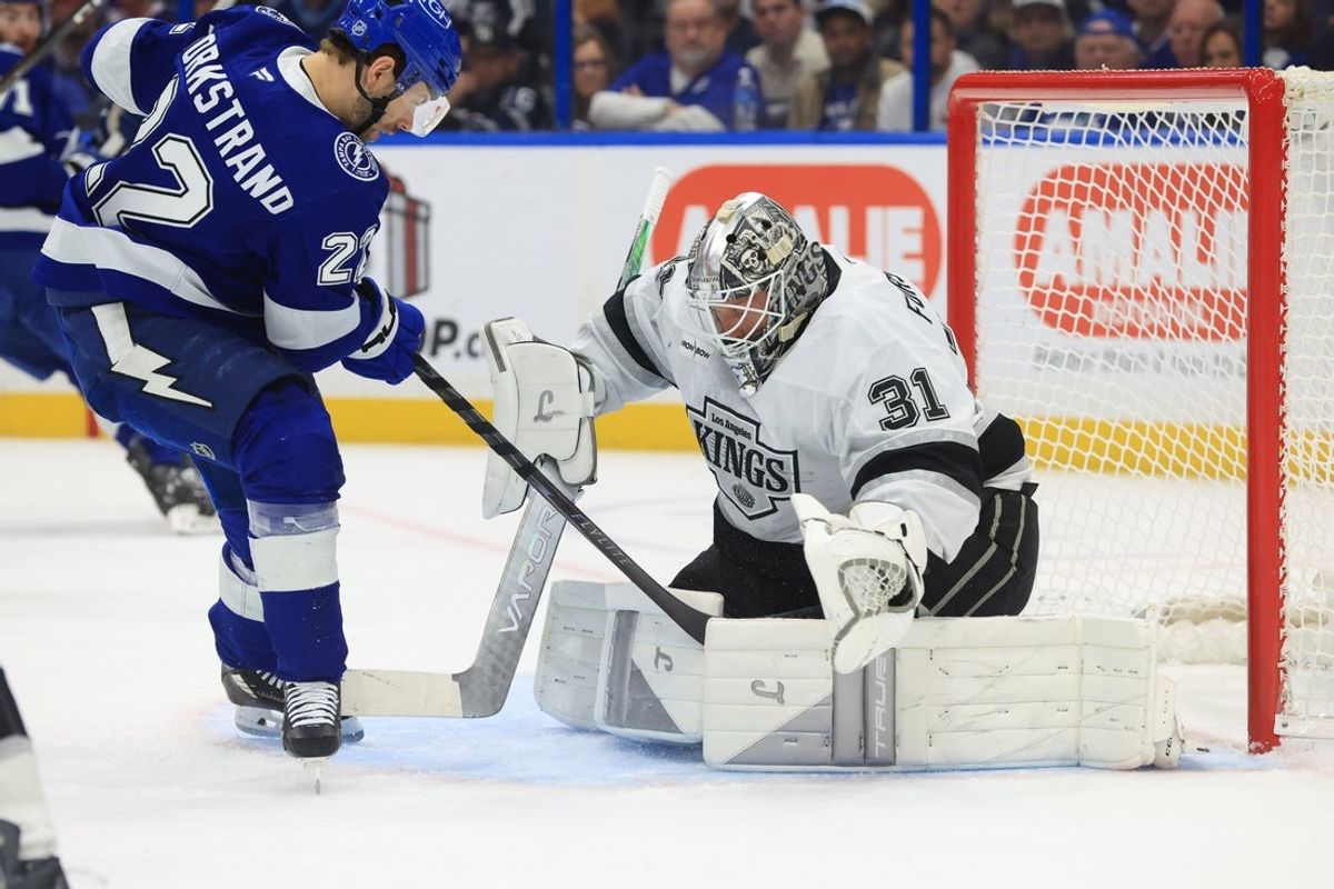 Dec 18, 2025; Tampa, Florida, USA; Tampa Bay Lightning right wing Oliver Bjorkstrand (22) shoots and scores a goal on Los Angeles Kings goaltender Anton Forsberg (31) during the first period at Benchmark International Arena. Mandatory Credit: Kim Klement Neitzel-Imagn Images