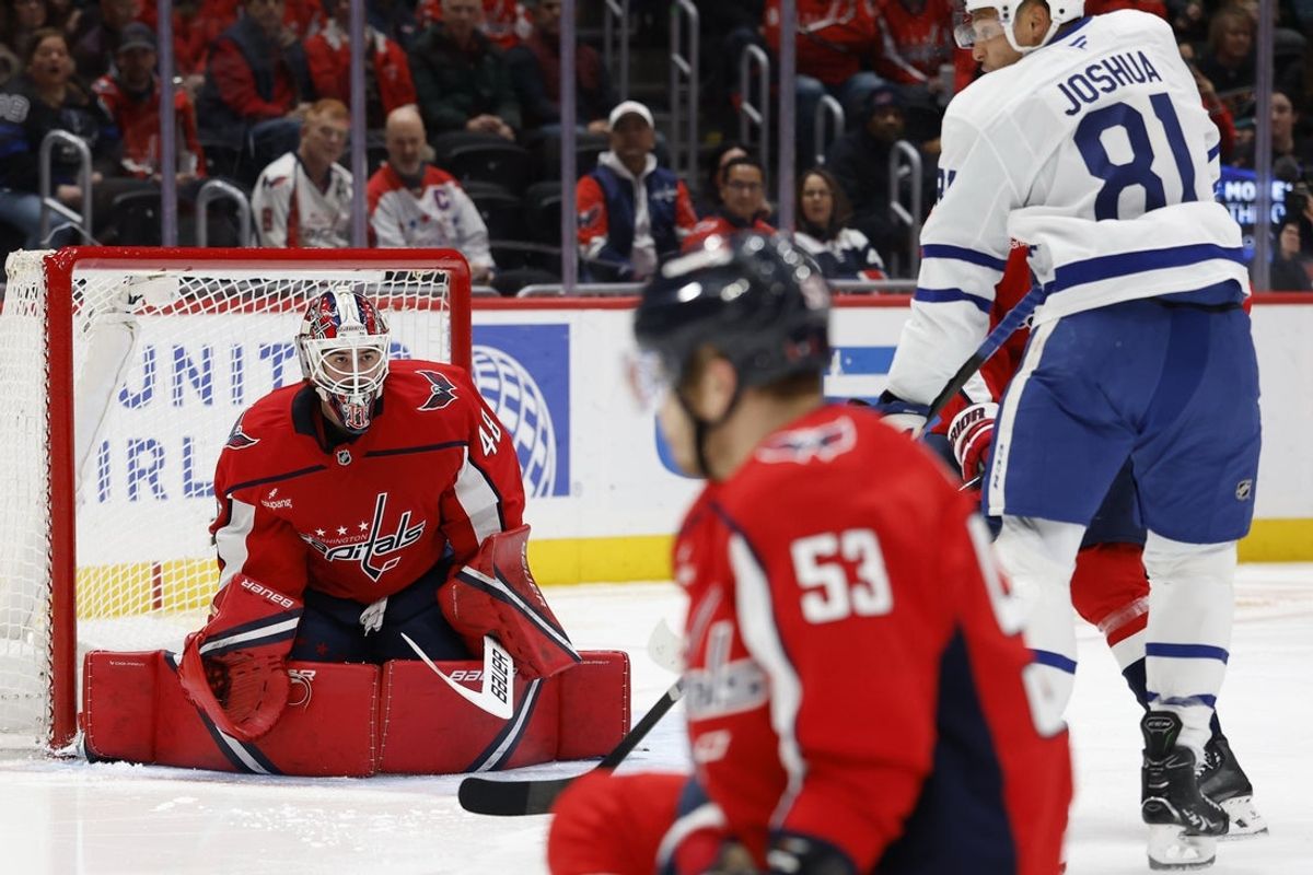 Dec 18, 2025; Washington, District of Columbia, USA; Washington Capitals goaltender Logan Thompson (48) prepares to make a save in front of Toronto Maple Leafs center Dakota Joshua (81) during the second period at Capital One Arena. Mandatory Credit: Geoff Burke-Imagn Images