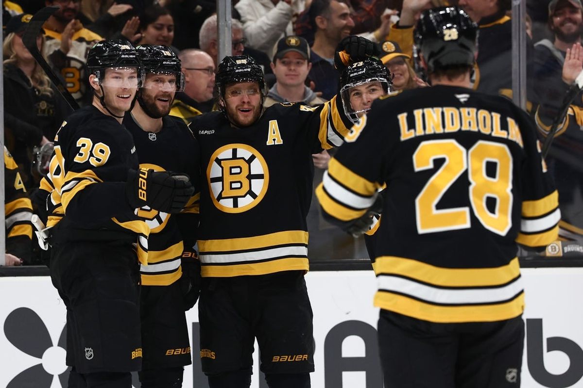 Dec 18, 2025; Boston, Massachusetts, USA; Boston Bruins center Pavel Zacha (18) (second from left) celebrates his goal with center Morgan Geekie (39) and right wing David Pastrnak (88) during the first period against the Edmonton Oilers at TD Garden. Mandatory Credit: Winslow Townson-Imagn Images