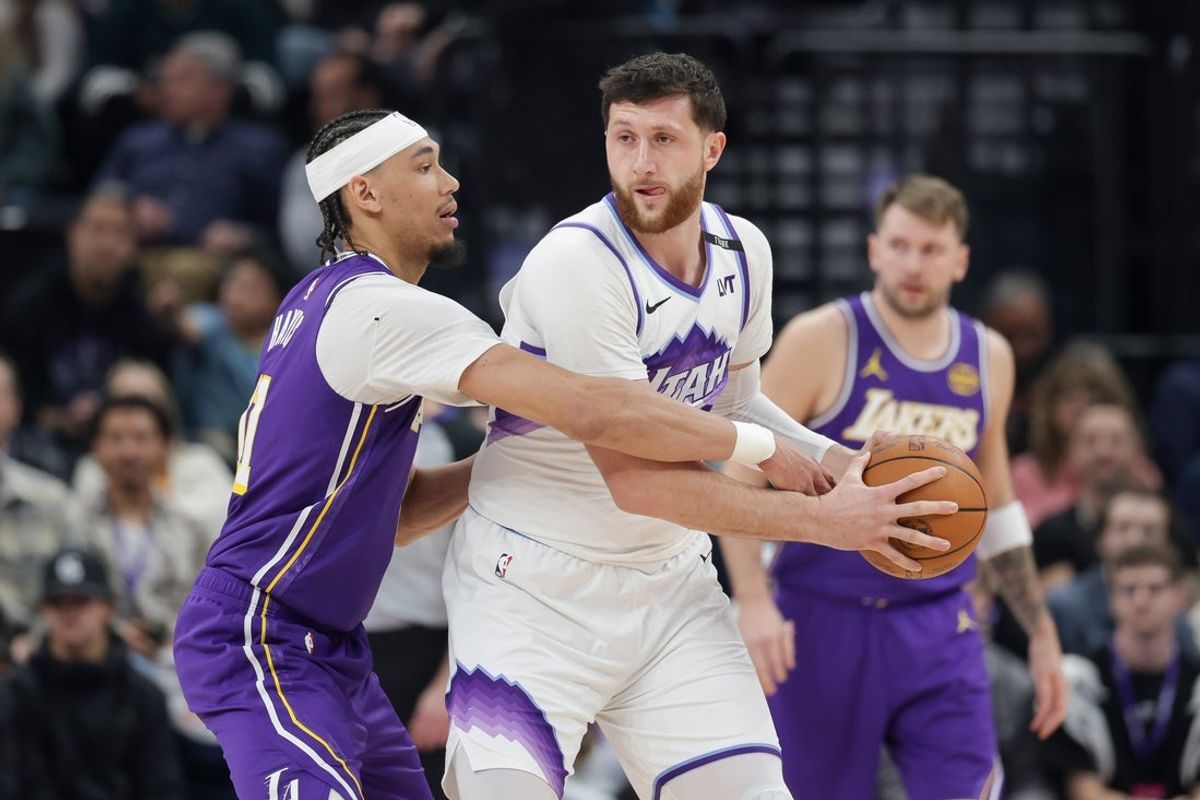 Dec 18, 2025; Salt Lake City, Utah, USA;  Utah Jazz center Jusuf Nurkic (30) keeps the ball from Los Angeles Lakers center/forward Jaxson Hayes (11) during the first quarter at Delta Center. Mandatory Credit: Chris Nicoll-Imagn Images