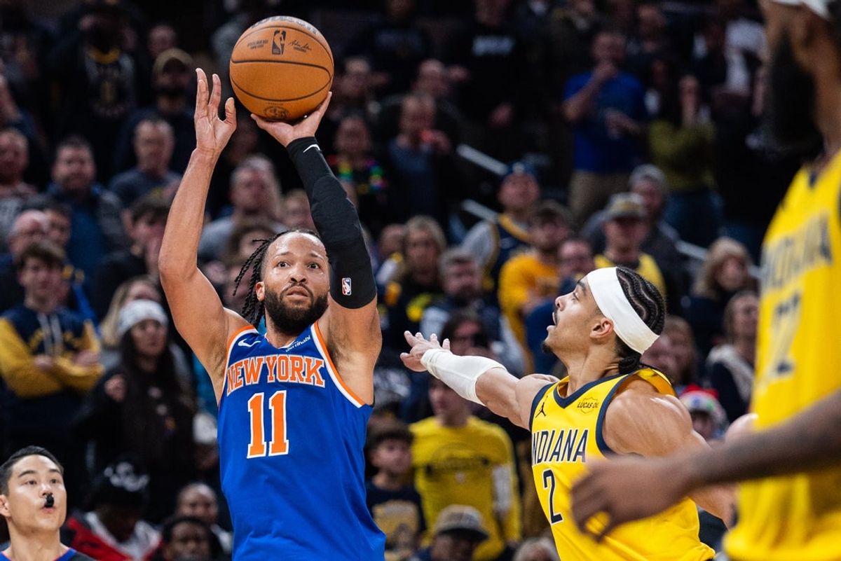 Dec 18, 2025; Indianapolis, Indiana, USA;  New York Knicks guard Jalen Brunson (11) shoots the winning shot  while Indiana Pacers guard/forward Andrew Nembhard (2) defends in the second half at Gainbridge Fieldhouse. Mandatory Credit: Trevor Ruszkowski-Imagn Images