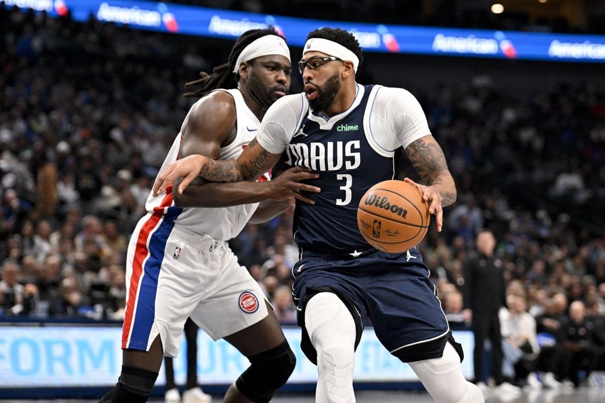 Dec 18, 2025; Dallas, Texas, USA; Dallas Mavericks forward Anthony Davis (3) drives to the basket against Detroit Pistons forward Isaiah Stewart (28) during the second quarter at the American Airlines Center. Mandatory Credit: Jerome Miron-Imagn Images