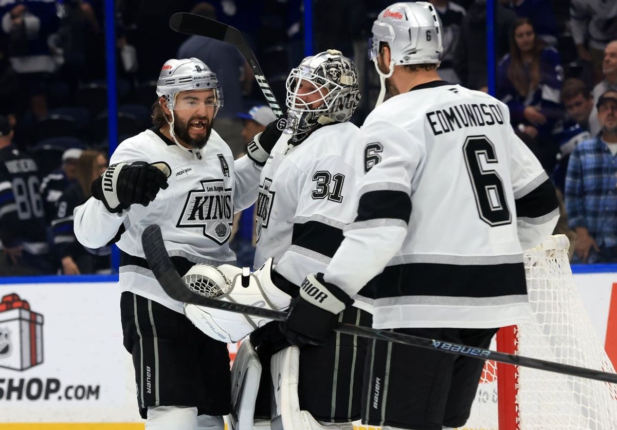Dec 18, 2025; Tampa, Florida, USA; Los Angeles Kings right wing Adrian Kempe (9), goaltender Anton Forsberg (31) and defenseman Joel Edmundson (6) celebrate after they beat the Tampa Bay Lightning at Benchmark International Arena. Mandatory Credit: Kim Klement Neitzel-Imagn Images