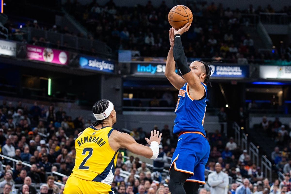 Dec 18, 2025; Indianapolis, Indiana, USA; New York Knicks guard Jalen Brunson (11)  shoots the ball while Indiana Pacers guard/forward Andrew Nembhard (2) defends in the second half at Gainbridge Fieldhouse. Mandatory Credit: Trevor Ruszkowski-Imagn Images