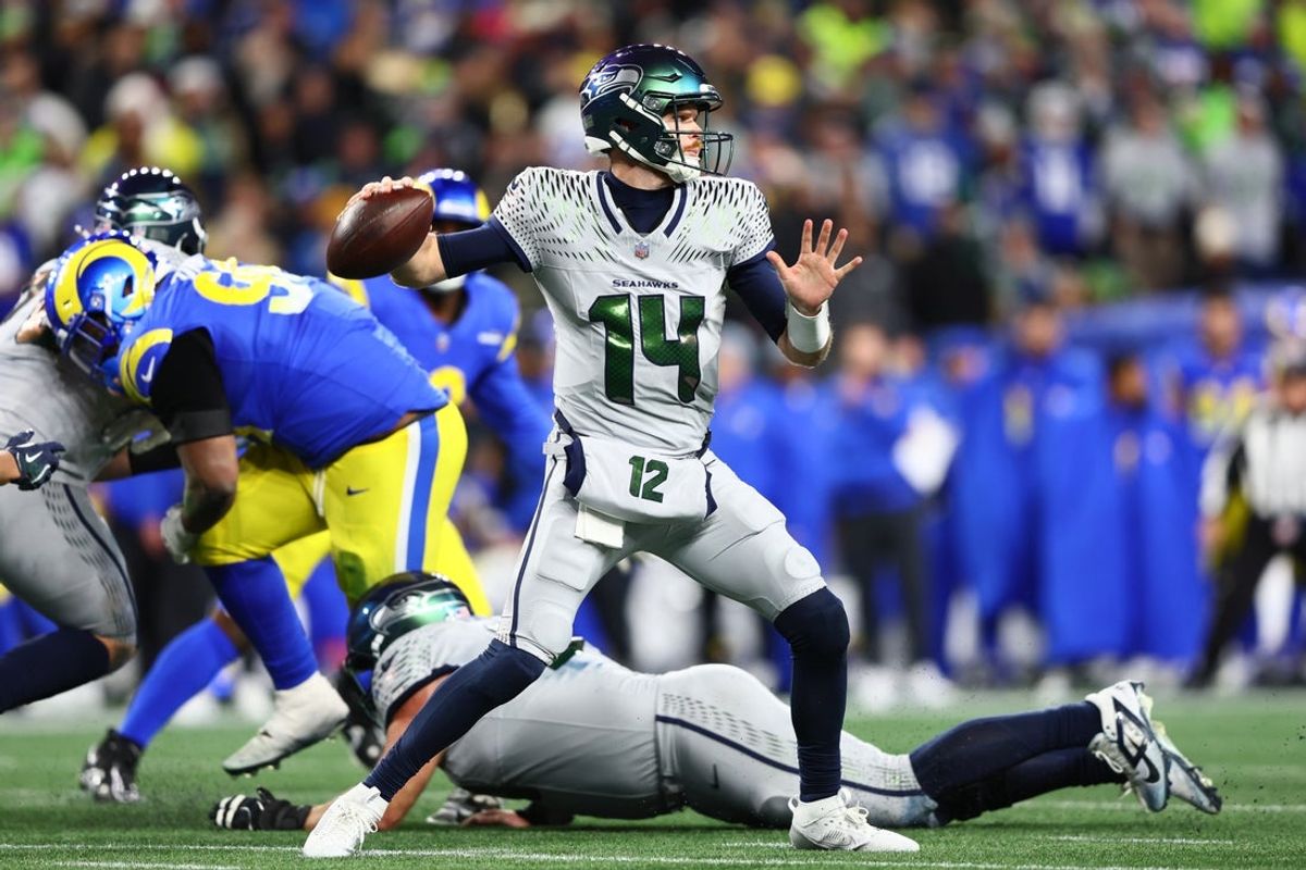 Dec 18, 2025; Seattle, Washington, USA; Seattle Seahawks quarterback Sam Darnold (14) throws a pass against the Los Angeles Rams in the second half at Lumen Field. Mandatory Credit: Kevin Ng-Imagn Images