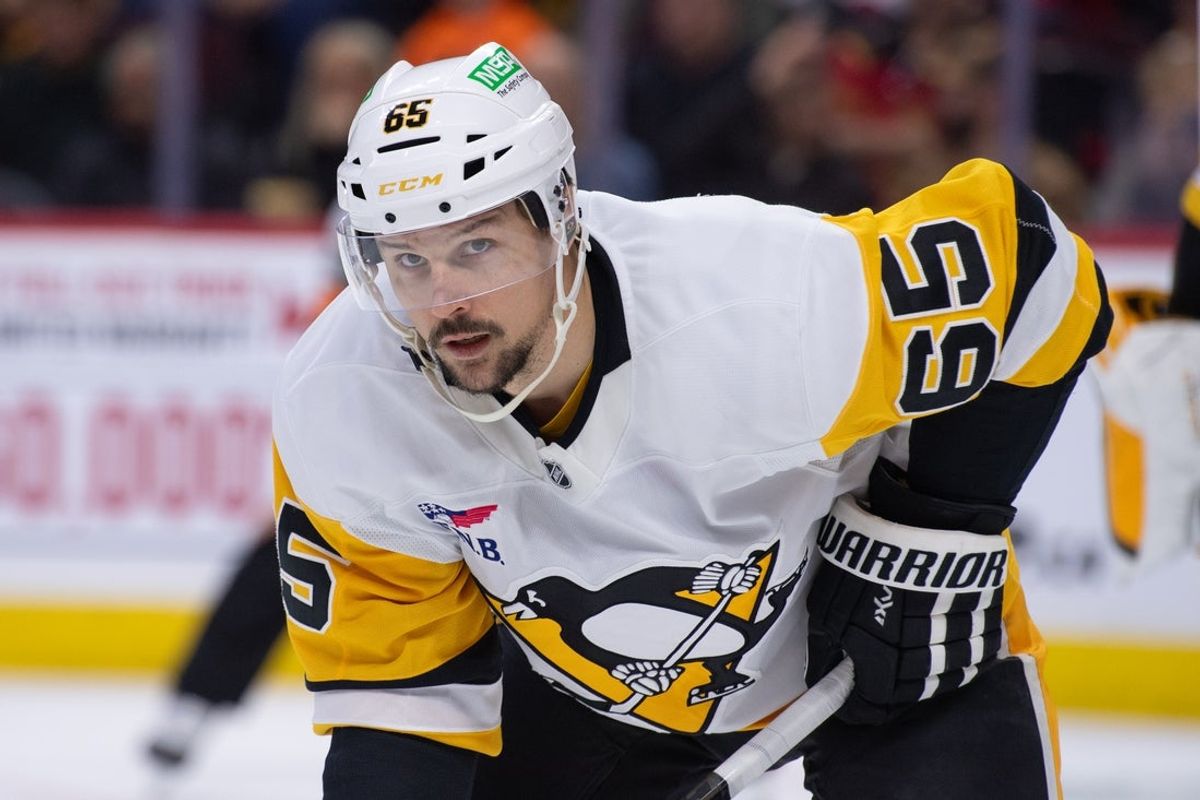 Dec 18, 2025; Ottawa, Ontario, CAN; Pittsburgh Penguins defenseman Erik Karlsson (65) prepares for a face off in the first period against the Ottawa Senators at the Canadian Tire Centre. Mandatory Credit: Marc DesRosiers-IMAGN Images