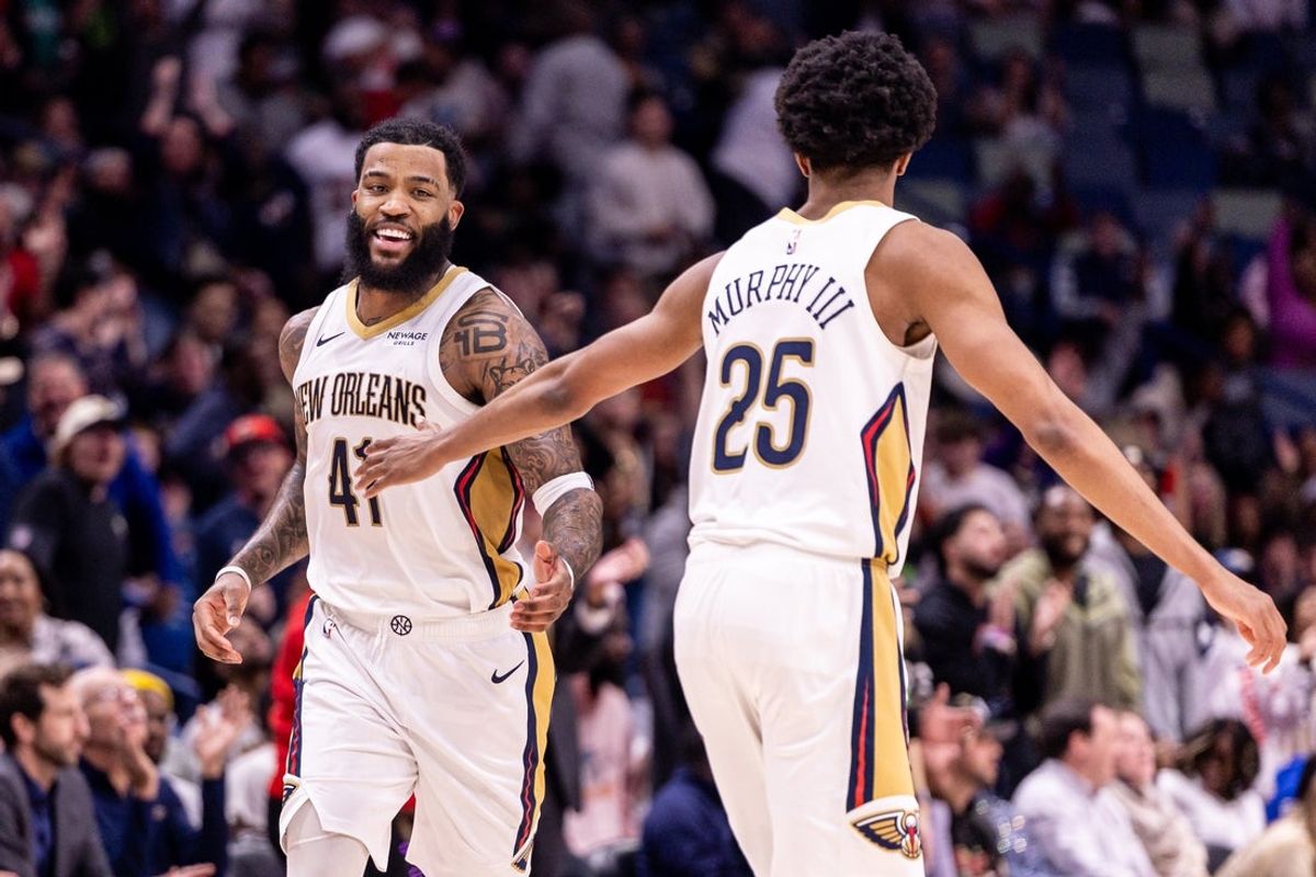 Dec 18, 2025; New Orleans, Louisiana, USA;  New Orleans Pelicans guard/forward Saddiq Bey (41) slaps hands with forward Trey Murphy III (25) after a play against the Houston Rockets during over time at Smoothie King Center. Mandatory Credit: Stephen Lew-Imagn Images