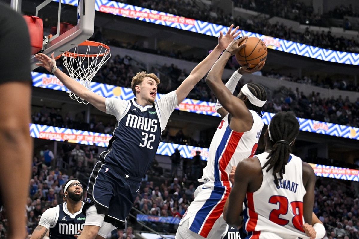Dec 18, 2025; Dallas, Texas, USA; Detroit Pistons guard Caris Levert (8) attempts a shot over Dallas Mavericks forward Cooper Flagg (32) during the second half at the American Airlines Center. Mandatory Credit: Jerome Miron-Imagn Images