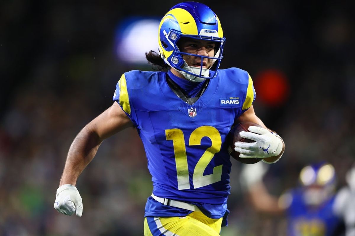 Dec 18, 2025; Seattle, Washington, USA; Los Angeles Rams wide receiver Puka Nacua (12) runs for a touchdown against the Seattle Seahawks in overtime at Lumen Field. Mandatory Credit: Kevin Ng-Imagn Images