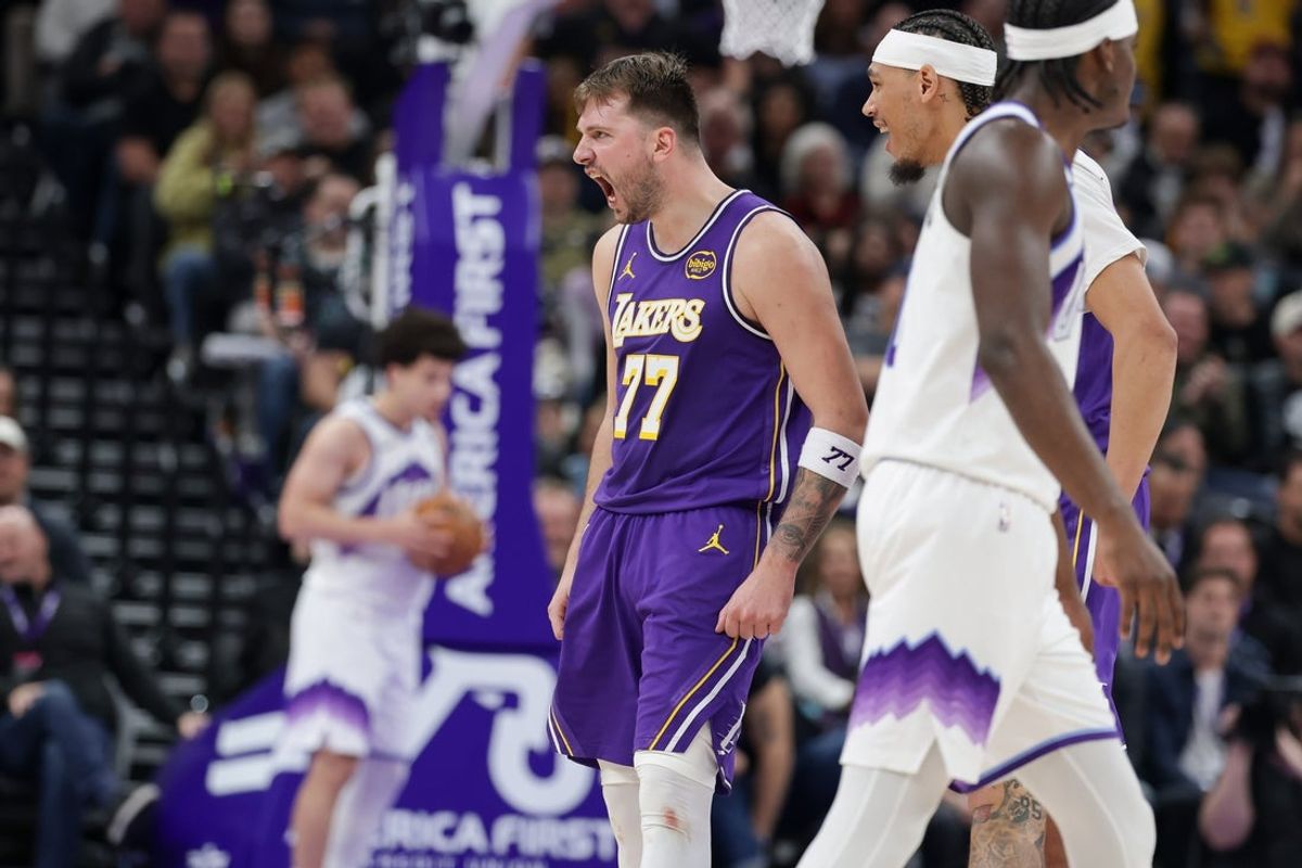 Dec 18, 2025; Salt Lake City, Utah, USA;  Los Angeles Lakers forward/guard Luka Doncic (77) celebrates after scoring a three point basket during the second half against the Utah Jazz at Delta Center. Mandatory Credit: Chris Nicoll-Imagn Images