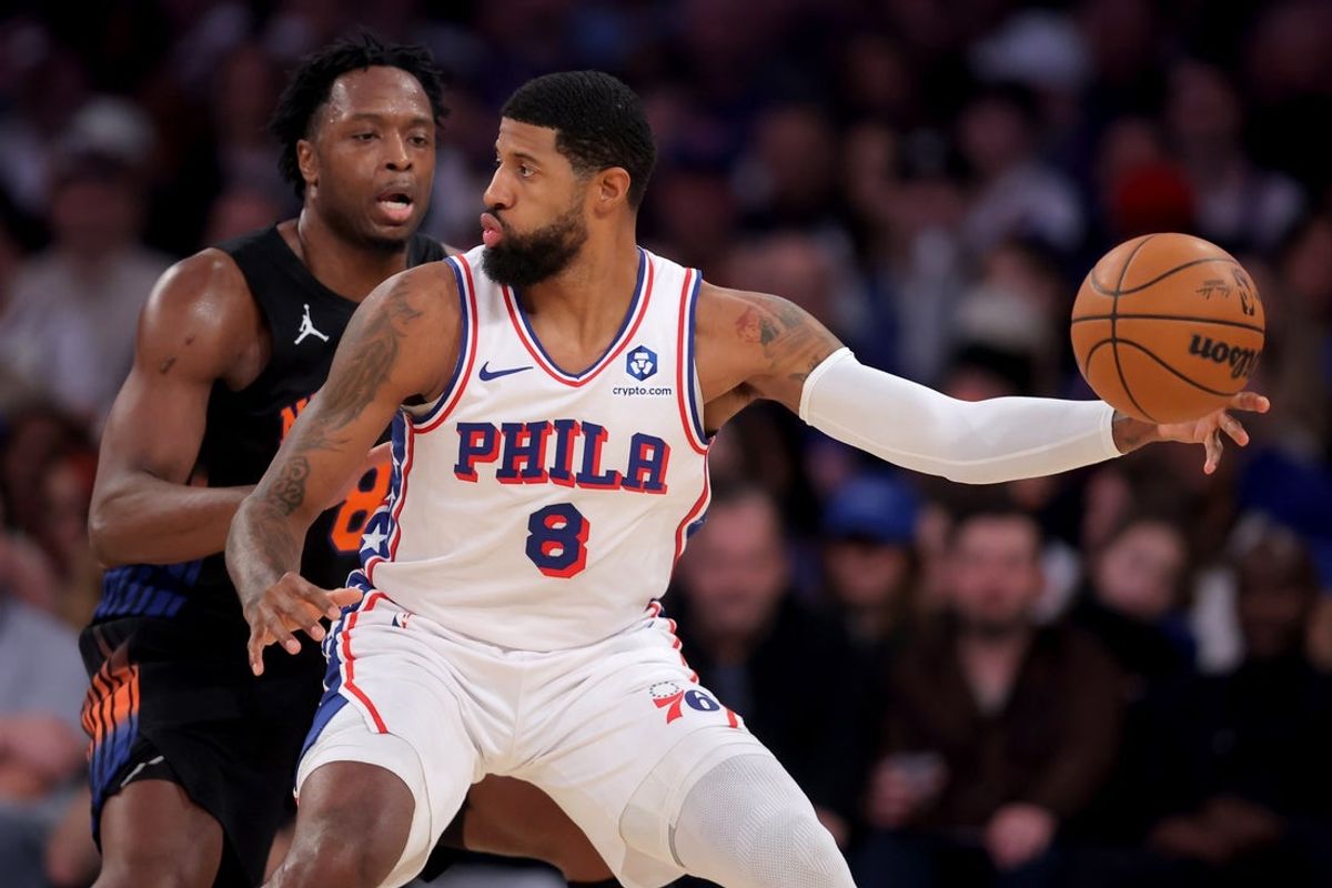 Dec 19, 2025; New York, New York, USA; Philadelphia 76ers forward Paul George (8) controls the ball against New York Knicks forward Og Anunoby (8) during the second quarter at Madison Square Garden. Mandatory Credit: Brad Penner-Imagn Images