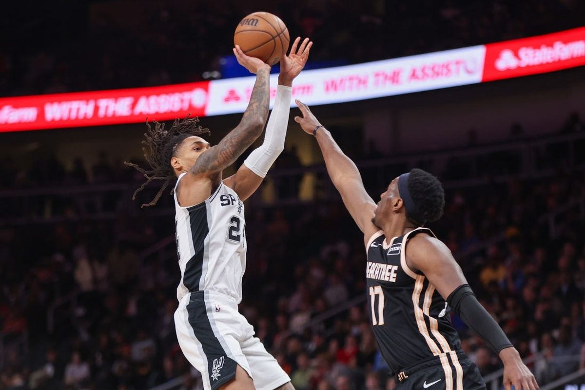 Dec 19, 2025; Atlanta, Georgia, USA; San Antonio Spurs guard Devin Vassell (24) shoots against the Atlanta Hawks in the second quarter at State Farm Arena. Mandatory Credit: Brett Davis-Imagn Images