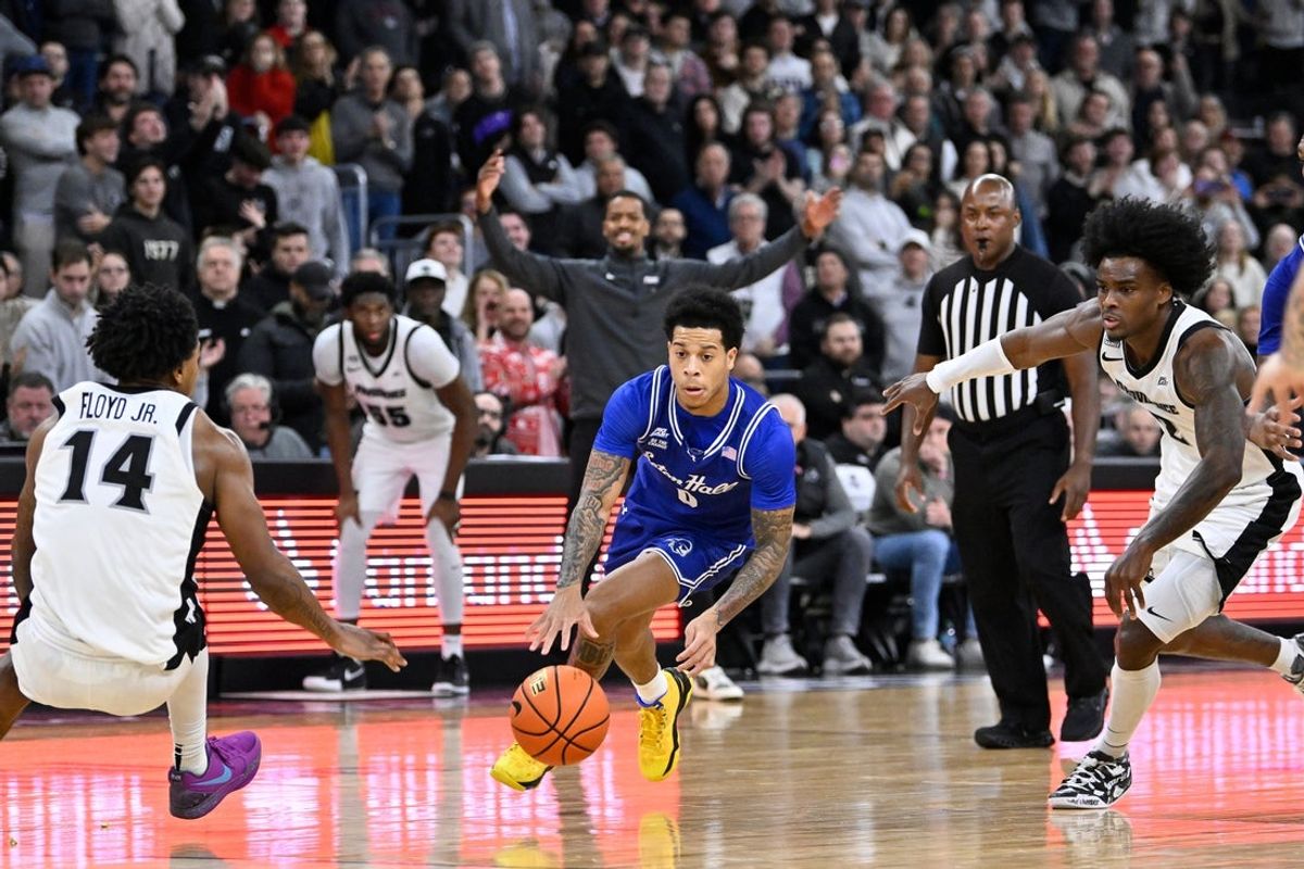 Dec 19, 2025; Providence, Rhode Island, USA; Seton Hall Pirates guard Adam Clark (0) drives to the basket against Providence Friars guard Jr. Corey Floyd (14) and guard Jaylin Sellers (2) during the second half at Amica Mutual Pavilion. Mandatory Credit: Eric Canha-Imagn Images