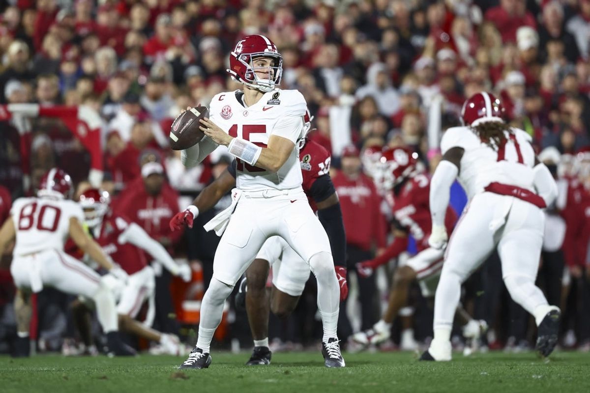 Dec 19, 2025; Norman, OK, USA; Alabama Crimson Tide quarterback Ty Simpson (15) looks to make a pass in the first half against the Oklahoma Sooners at Gaylord Family OK Memorial Stadium. Mandatory Credit: Mark J. Rebilas-Imagn Images