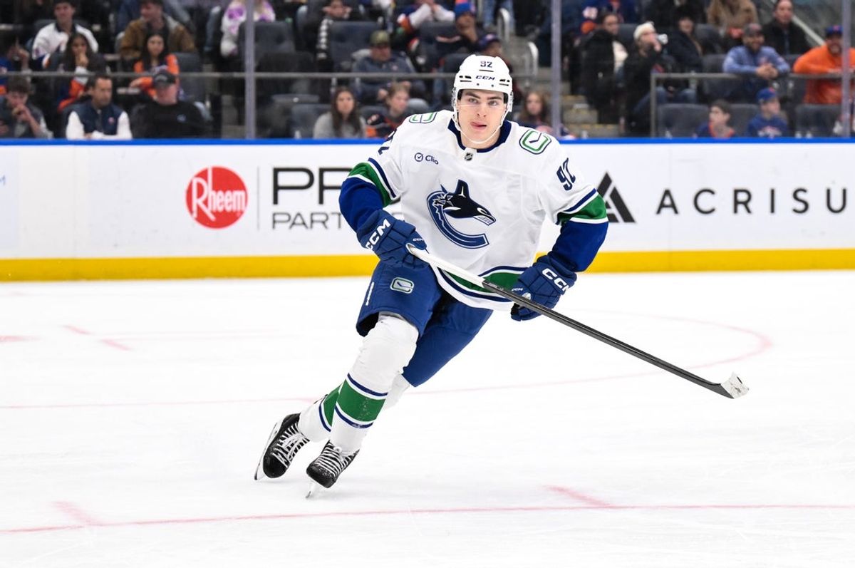 Dec 19, 2025; Elmont, New York, USA; Vancouver Canucks left wing Liam Ohgren (92) skates against the New York Islanders during the third period at UBS Arena. Mandatory Credit: John Jones-Imagn Images