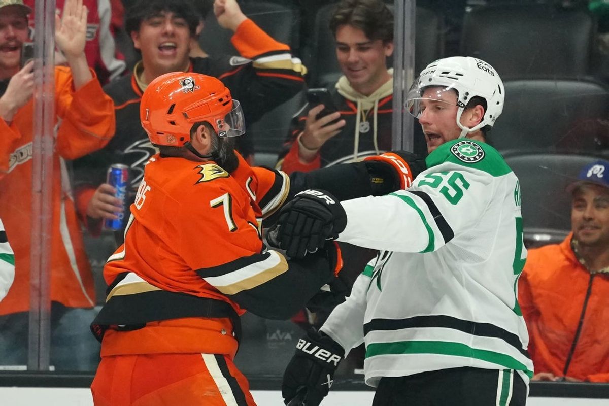 Dec 19, 2025; Anaheim, California, USA; Anaheim Ducks defenseman Radko Gudas (7) shoves Dallas Stars defenseman Thomas Harley (55) in the third period at Honda Center. Mandatory Credit: Kirby Lee-Imagn Images