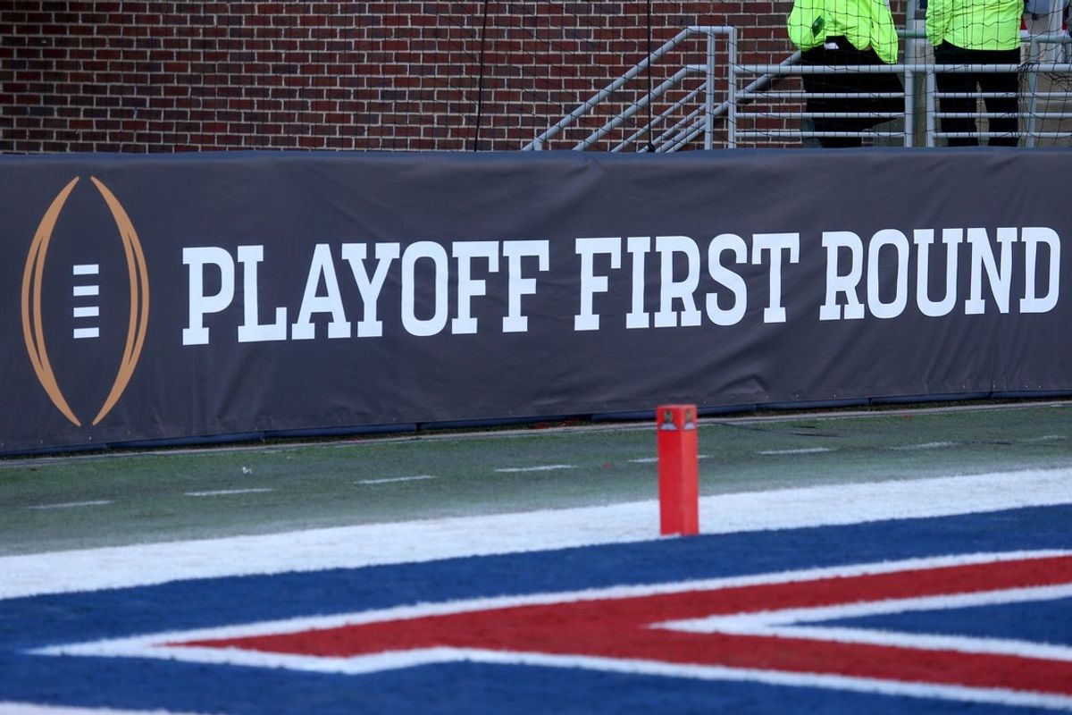 Dec 20, 2025; Oxford, MS, USA; College Football First Round logo on field prior to the game between the Tulane Green Wave and  the Mississippi Rebels at Vaught-Hemingway Stadium. Mandatory Credit: Petre Thomas-Imagn Images