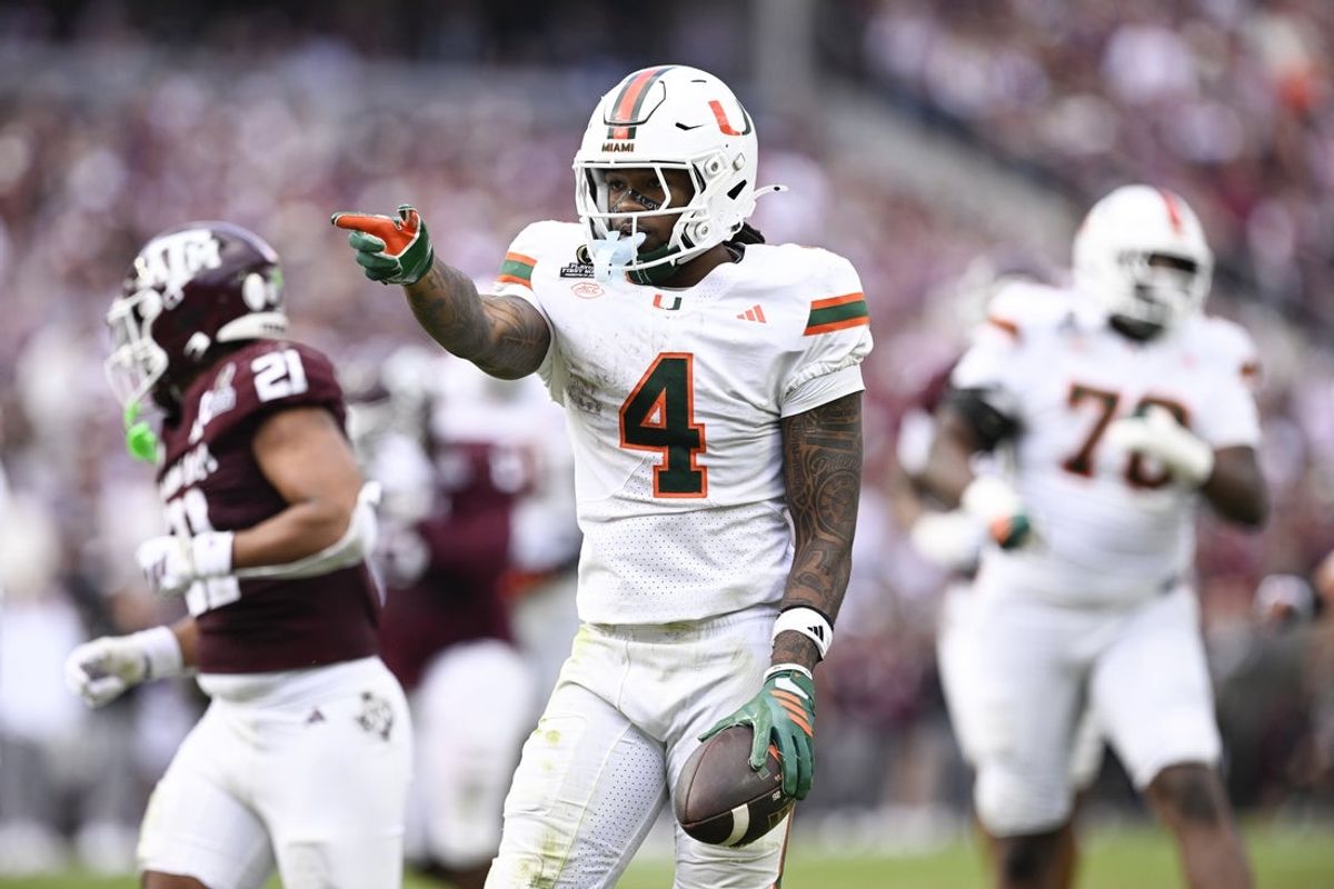 Dec 20, 2025; College Station, TX, USA; Miami Hurricanes running back Mark Fletcher Jr. (4) reacts after his rim against the Texas A&M Aggies during the second half of the first round game of the CFP National Playoff at Kyle Field. Mandatory Credit: Jerome Miron-Imagn Images