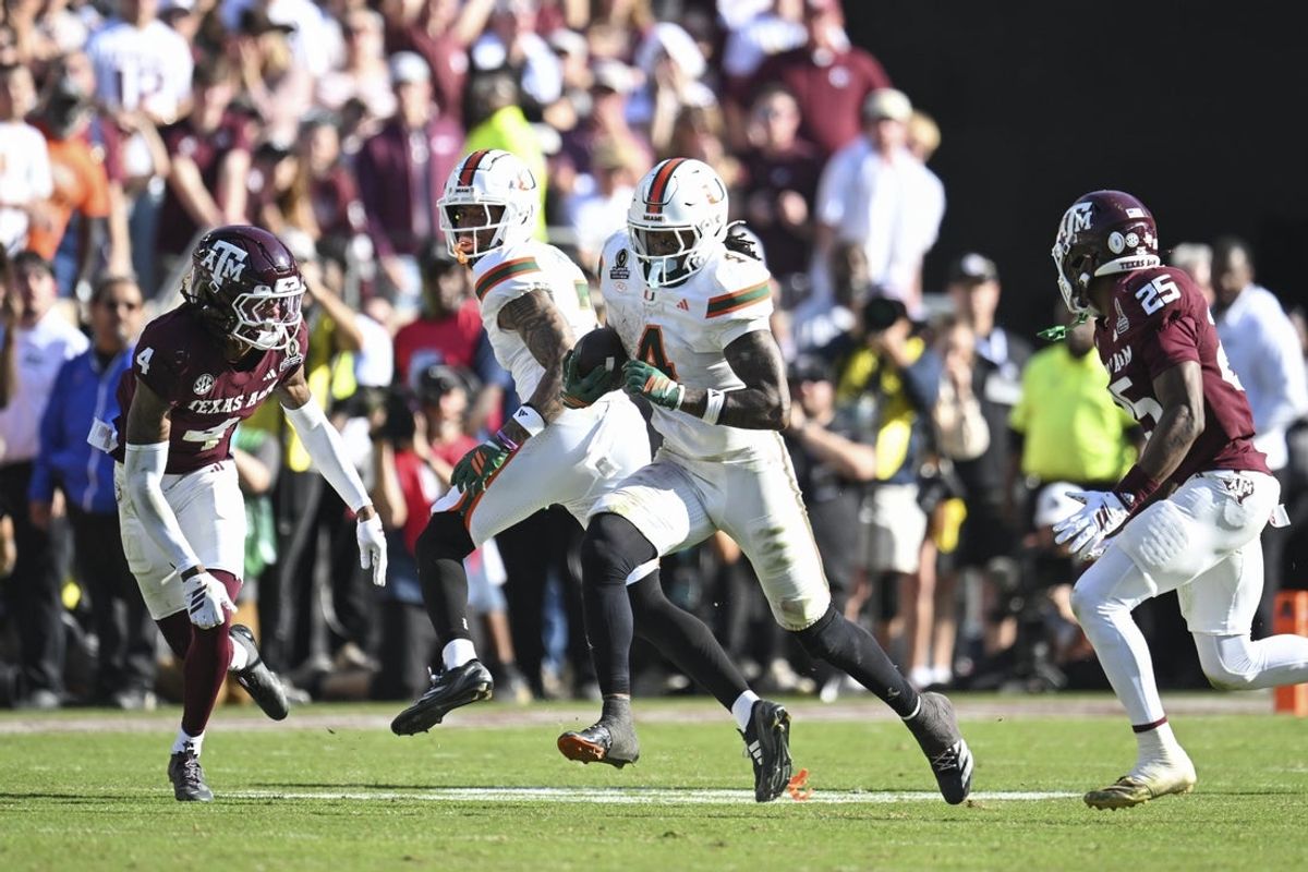 Dec 20, 2025; College Station, TX, USA; Miami Hurricanes running back Mark Fletcher Jr. (4) runs the ball against Texas A&M Aggies cornerback Will Lee III (4) during the second half of the first round game of the CFP National Playoff at Kyle Field. Mandatory Credit: Maria Lysaker-Imagn Images
